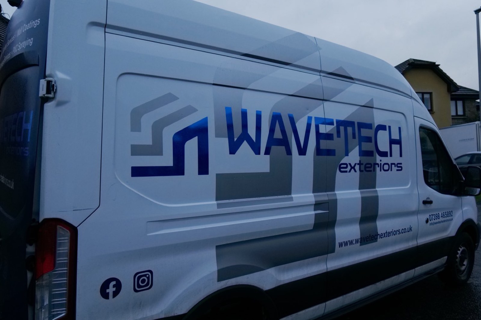 The WaveTech Exteriors branding on the company van